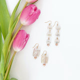 Classic, with an edge, these square freshwater pearl earrings are a staple item for every jewelry wardrobe. They're accented by a faceted pink moonstones roundel and look amazing with any outfit and brighten your face - who doesn't love that?!