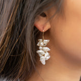 This earring features a waterfall of white freshwater keishi pearls that moves beautifully with you and illuminates your face. They may be the perfect "go with anything" piece!