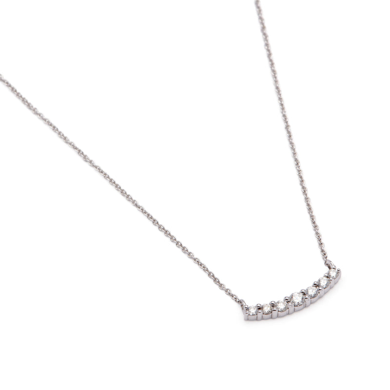Simple and classic, this necklace features seven sparkling white diamonds in a graduated bar. It is a perfect everyday necklace and layers well with others when you want a bigger look!