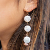 These beautiful earrings dance from your ears, reflecting light upon your face with every move you make. Three lovely white coin pearls are capped off with a faceted pink moonstone that lends a feminine elegance to these beauties. Getting married soon? These also look lovely as bridal jewelry or bridesmaid gifts - and can be customized on the accent stone to match your dresses. They're a gift that your girls are sure to wear for years to come!