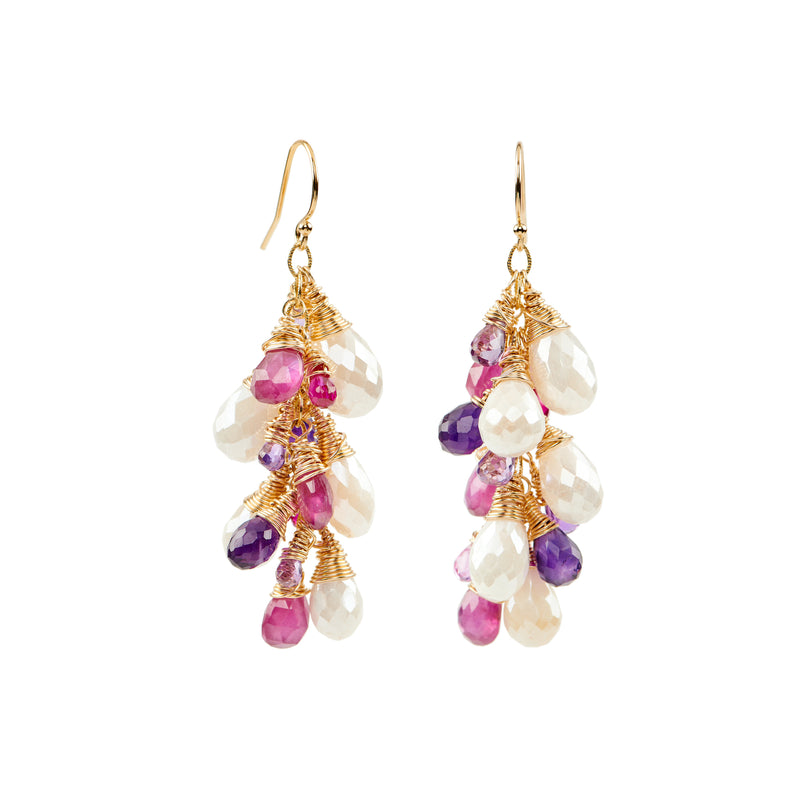 These earrings are the perfect Spring and Summer statement piece. The white moonstone, pink sapphires and purple amethyst sparkle beautifully as they cascade in a waterfall from gold-filled ear wires. These are sure to turn some heads!