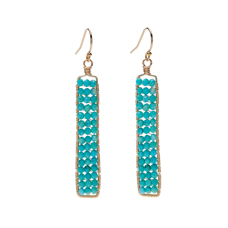 These earrings add a touch of understated elegance to your look. Shimmering with Sleeping Beauty turquoise roundels hand-wrapped on a handmade rectangular frame, these earrings draw a ton of compliments!