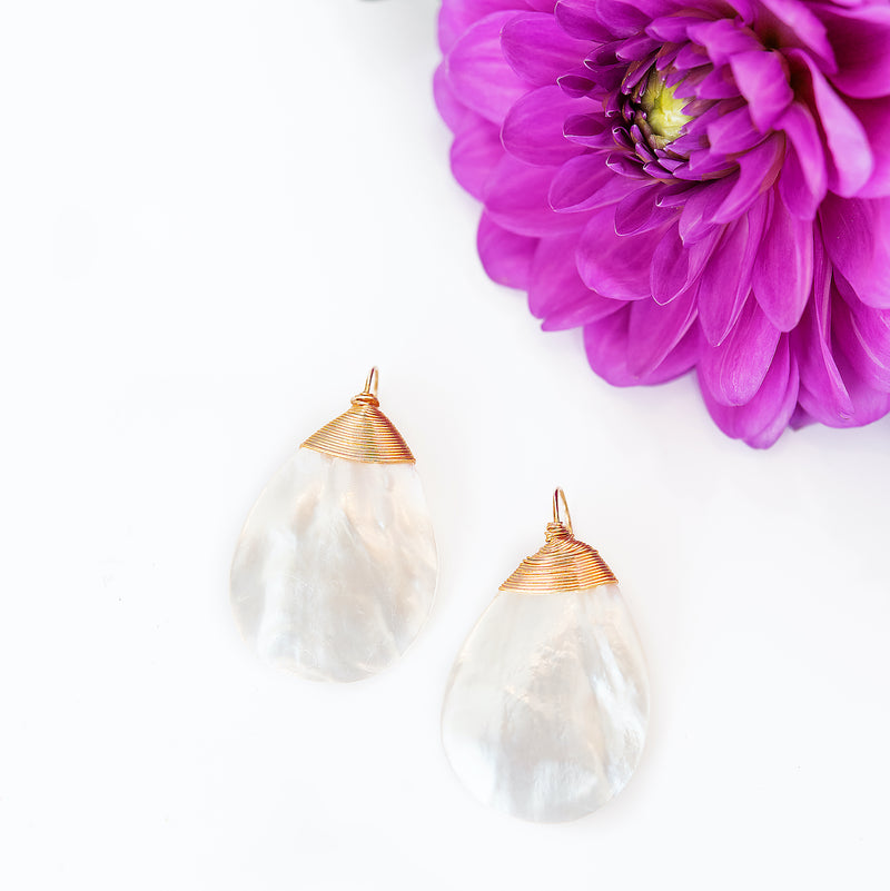 Simple. Chic. Beautiful. These mother of pearl earrings are a classic design - perfect to throw on with your favorite Summer dress or shorts and a fun top. Getting married soon? These also look lovely as bridesmaid gifts - they will look great in photos and they're a gift that your girls are sure to wear for years to come!