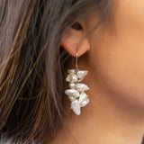 This earring features a waterfall of white freshwater keishi pearls that moves beautifully with you and illuminates your face. They may be the perfect "go with anything" piece!