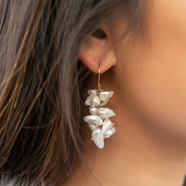 This earring features a waterfall of white freshwater keishi pearls that moves beautifully with you and illuminates your face. They may be the perfect "go with anything" piece!
