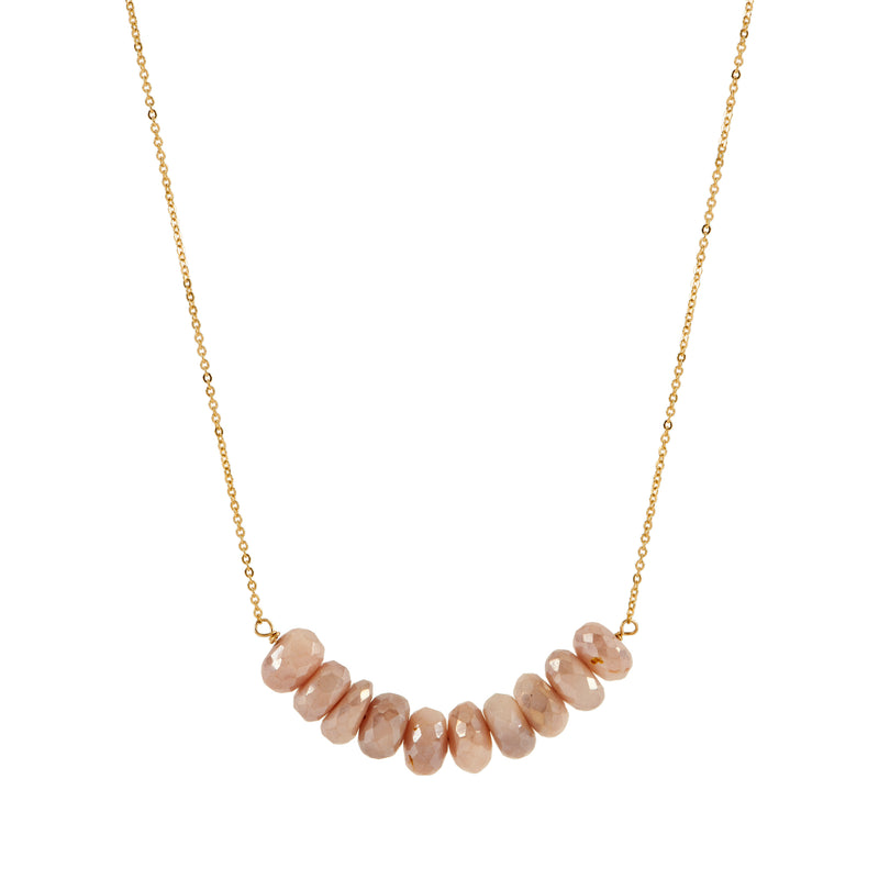 This pale peach beauty is the perfect addition to your Summer wardrobe! It looks great worn alone or as the shortest piece in a layered look. 