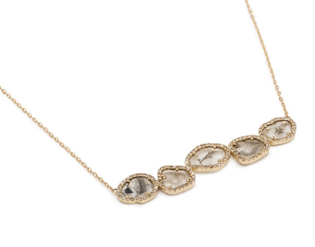 Simply breathtaking. This beauty gets compliments every single time you wear it! The diamond slices sparkle as much as the faceted diamonds surrounding it. This necklace looks fantastic alone or layered up with other pieces, which is easy to do with the adjustable length options in the back. This special design is sure to become an heirloom piece.